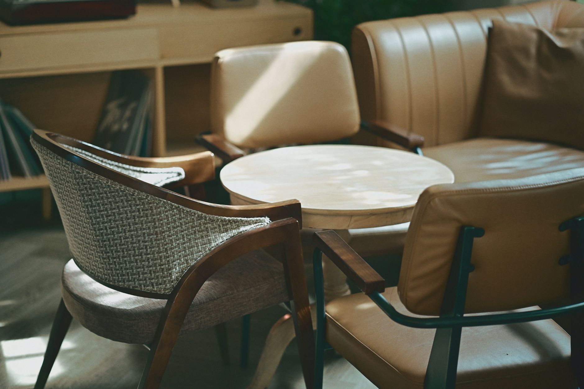 Elegant leather and fabric armchairs in a modern living room interior