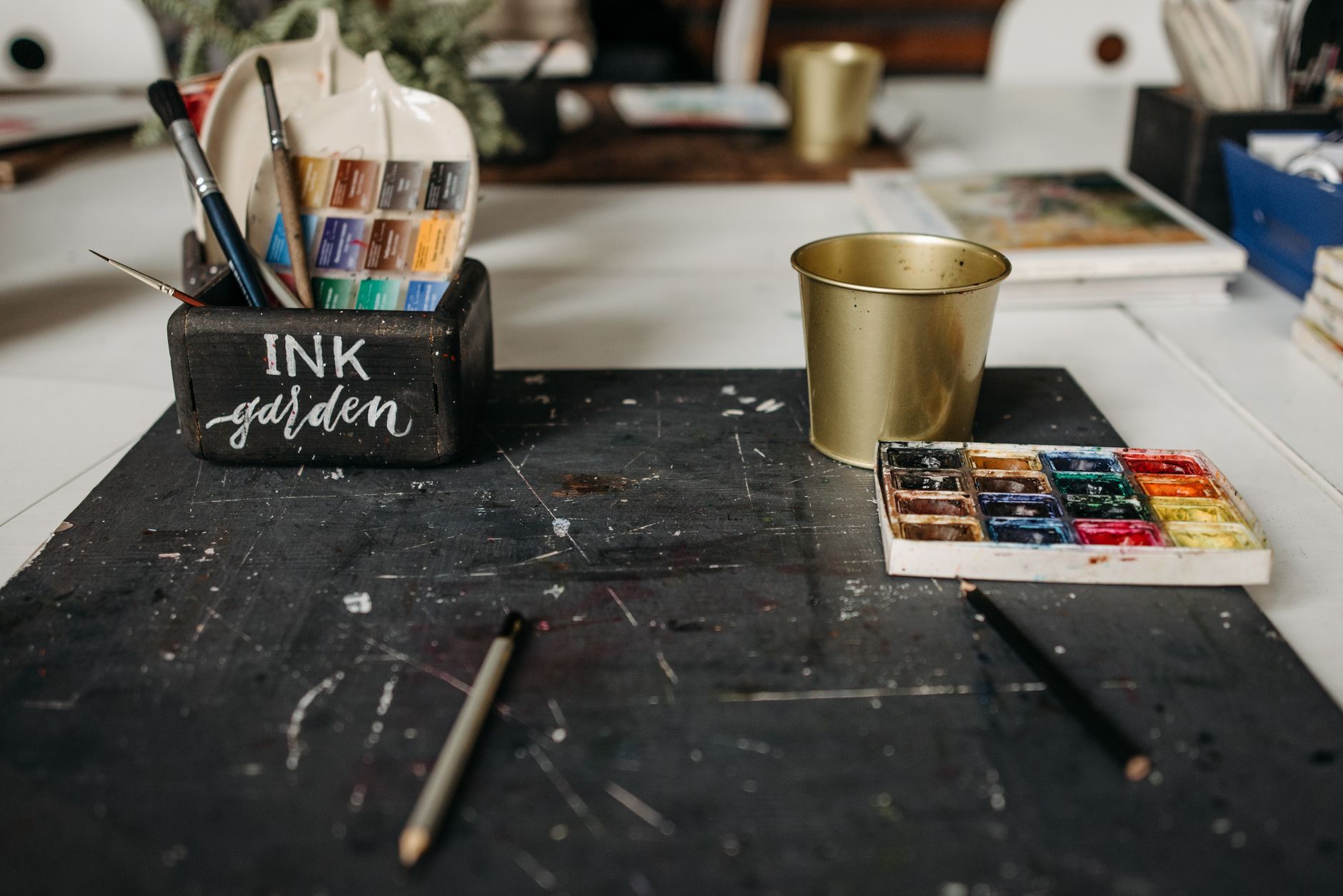 Creative office desk featuring colorful sticky notes with charts and design sketches.