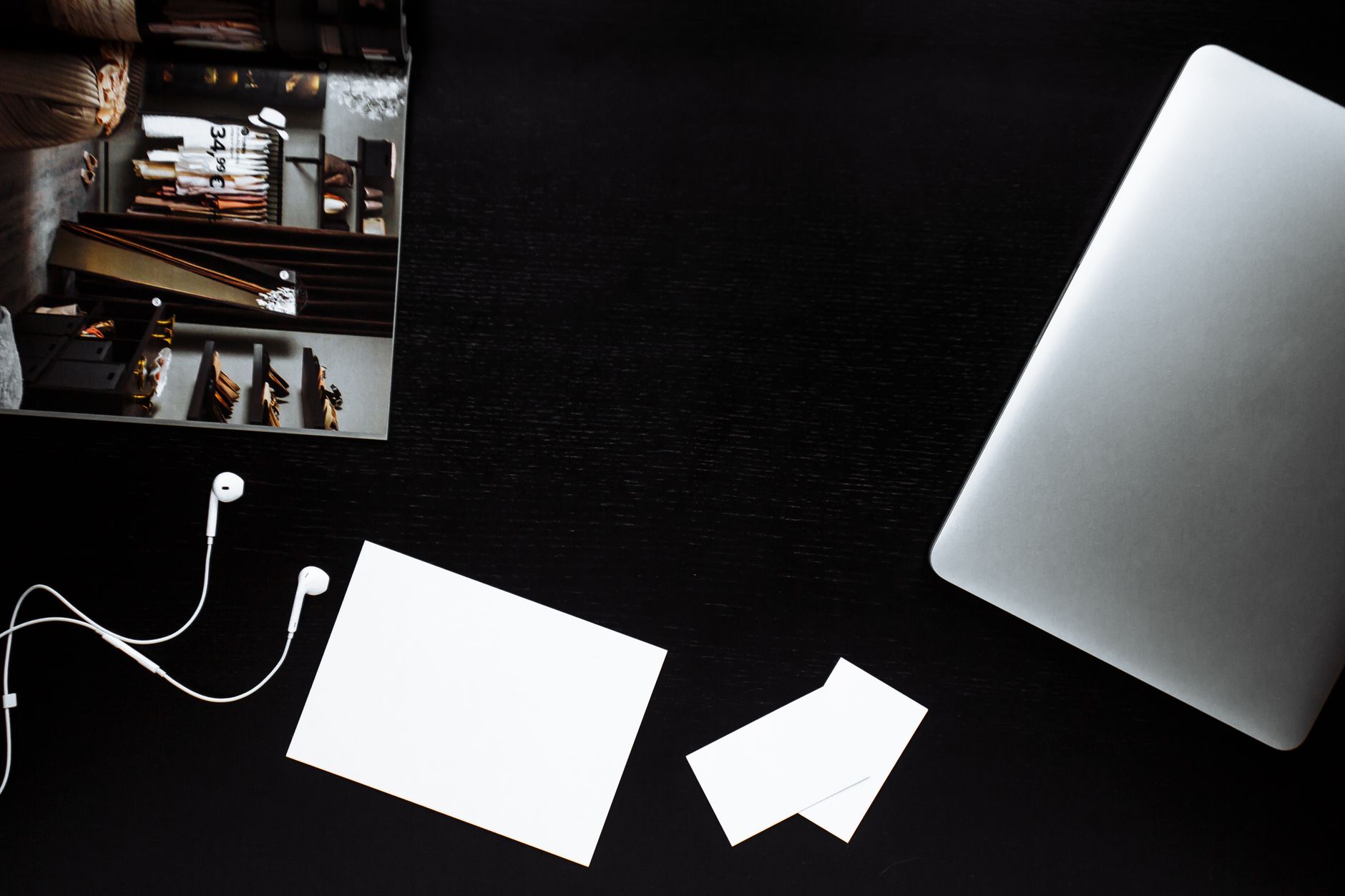 Sketches and samples of a branding project laid out on a table in a creative agency office